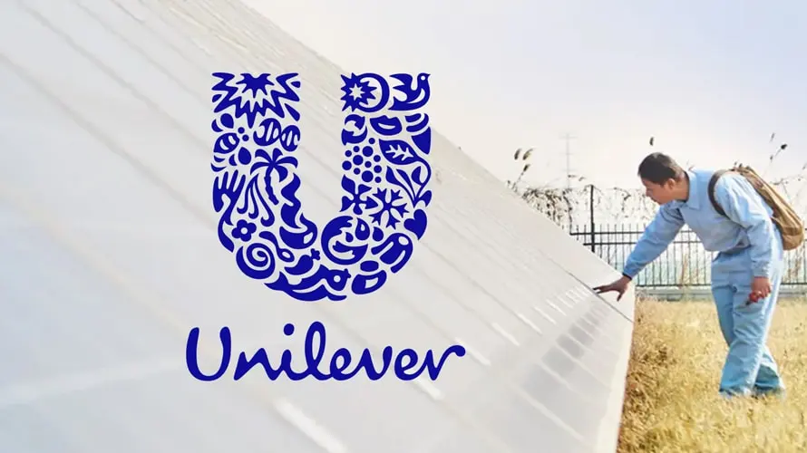 man touching the unilever logo