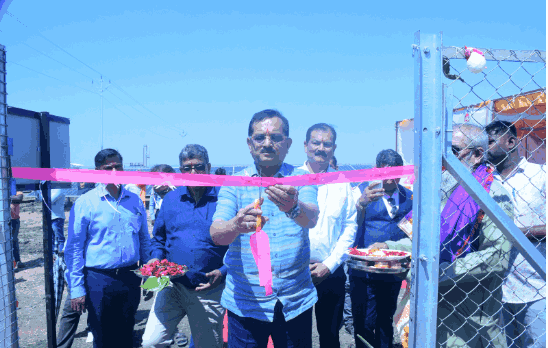 man cutting the ribbon