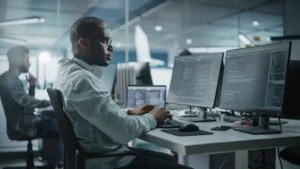 this image about man working on laptop