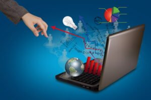image about Hand near a laptop that expels graphics and arrows